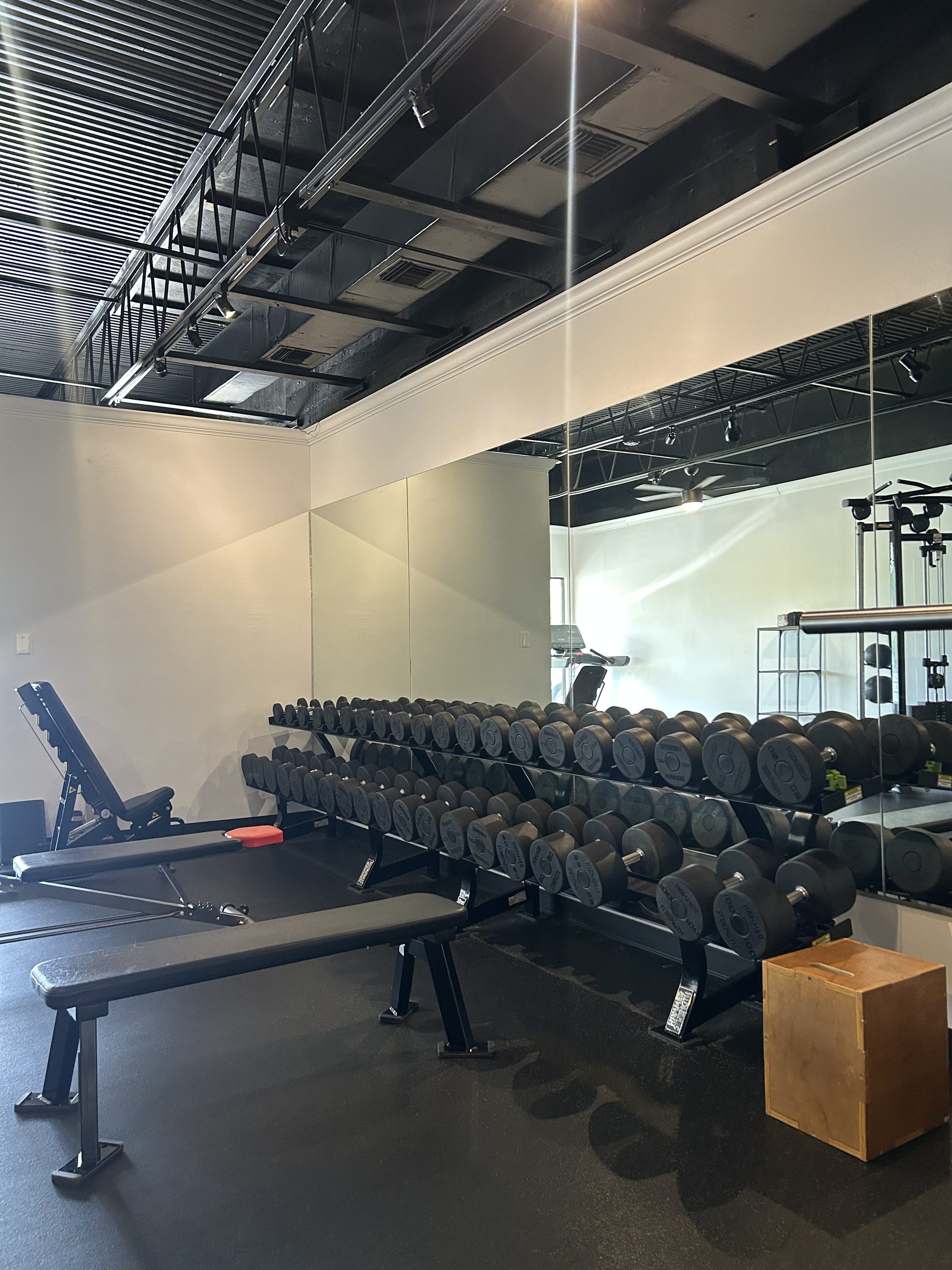 Free weights and rack area at the Fitness Training 360 private personal training studio